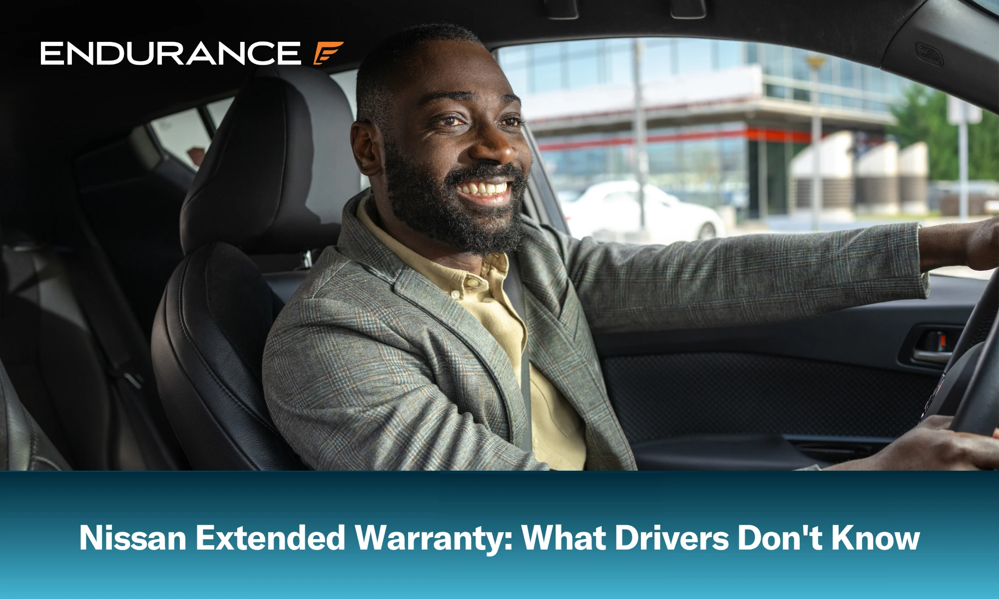 A man in a suit driving a Nissan through the city, what to know about Nissan extended warranties