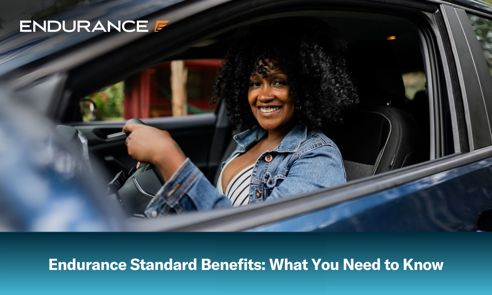 A middle aged African American woman driving a blue car