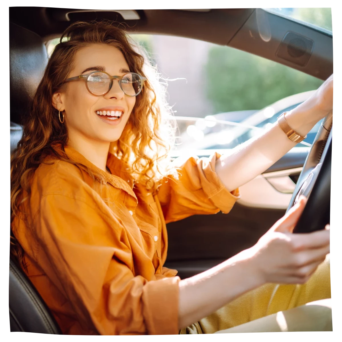 Happy woman driving her car