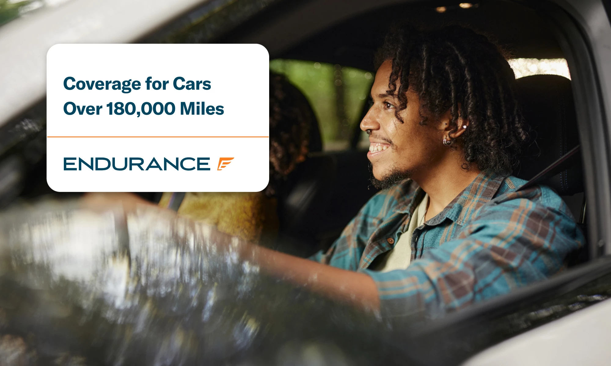 Happy African American man driving his car