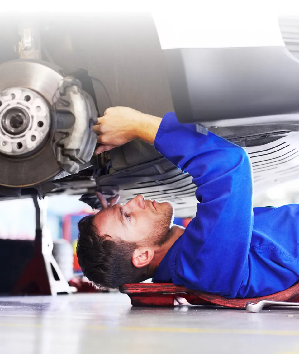 Mechanic working on vehicle
