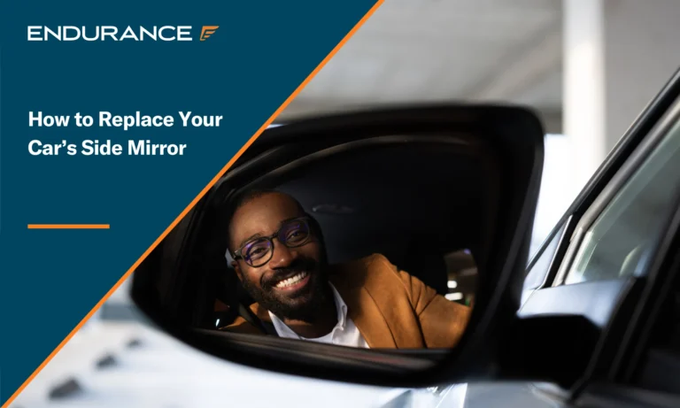Man looking into his car's side mirror