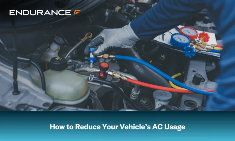 Mechanic checking and fixing car air conditioner system in a garage