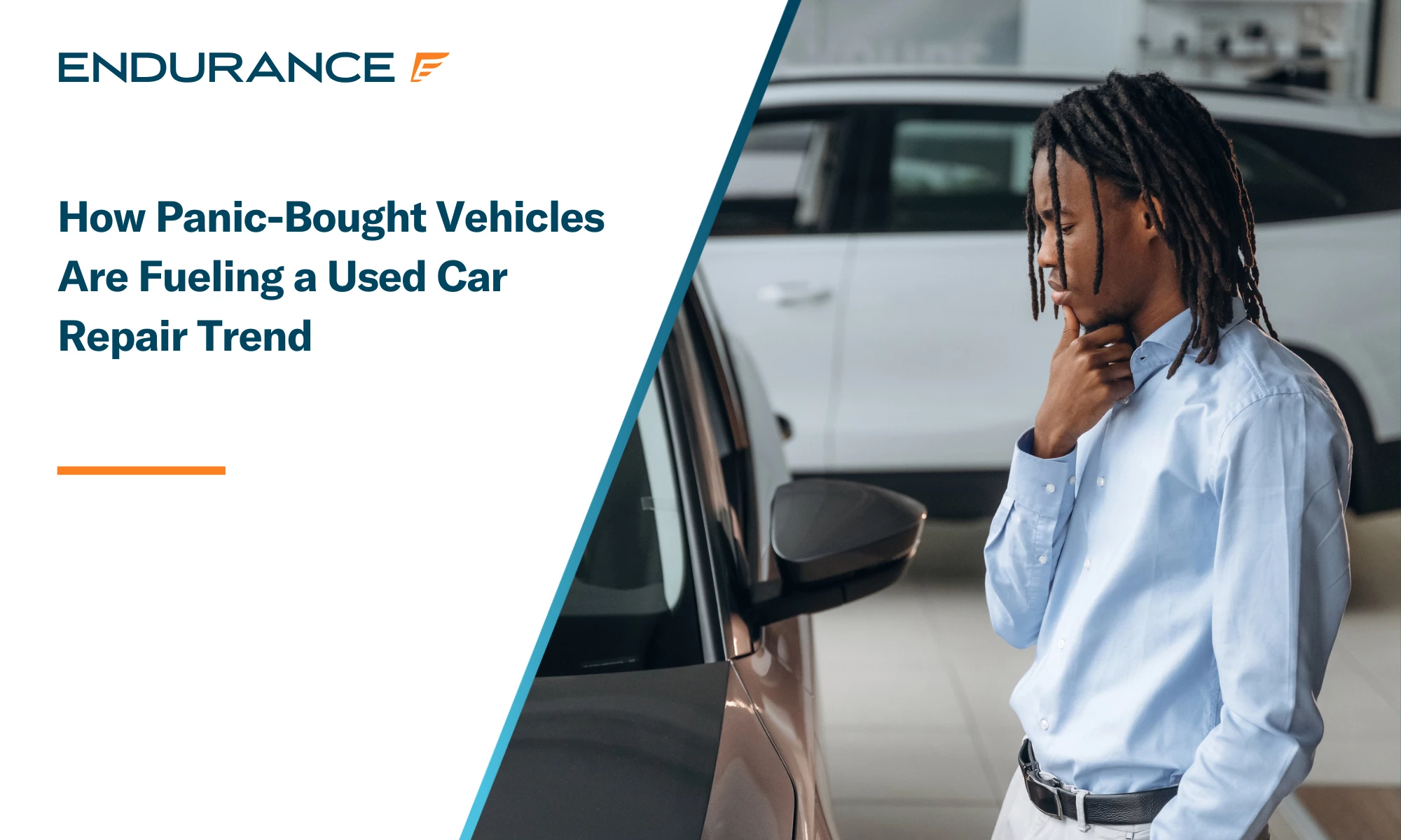 A car salesman looking at a used in car in a dealership