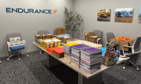 A conference room at Endurance with supplies to fill backpacks