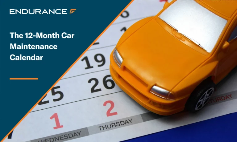 Orange toy car sitting on the background of a calendar