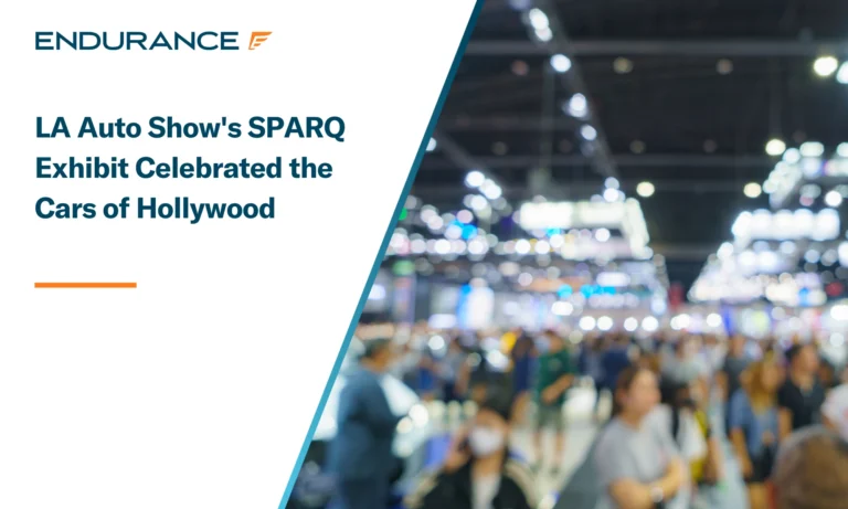 A crowd of people at a public exhibit or auto show