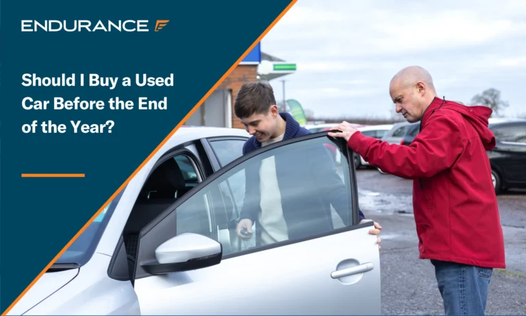 A man and his young son buying a used car