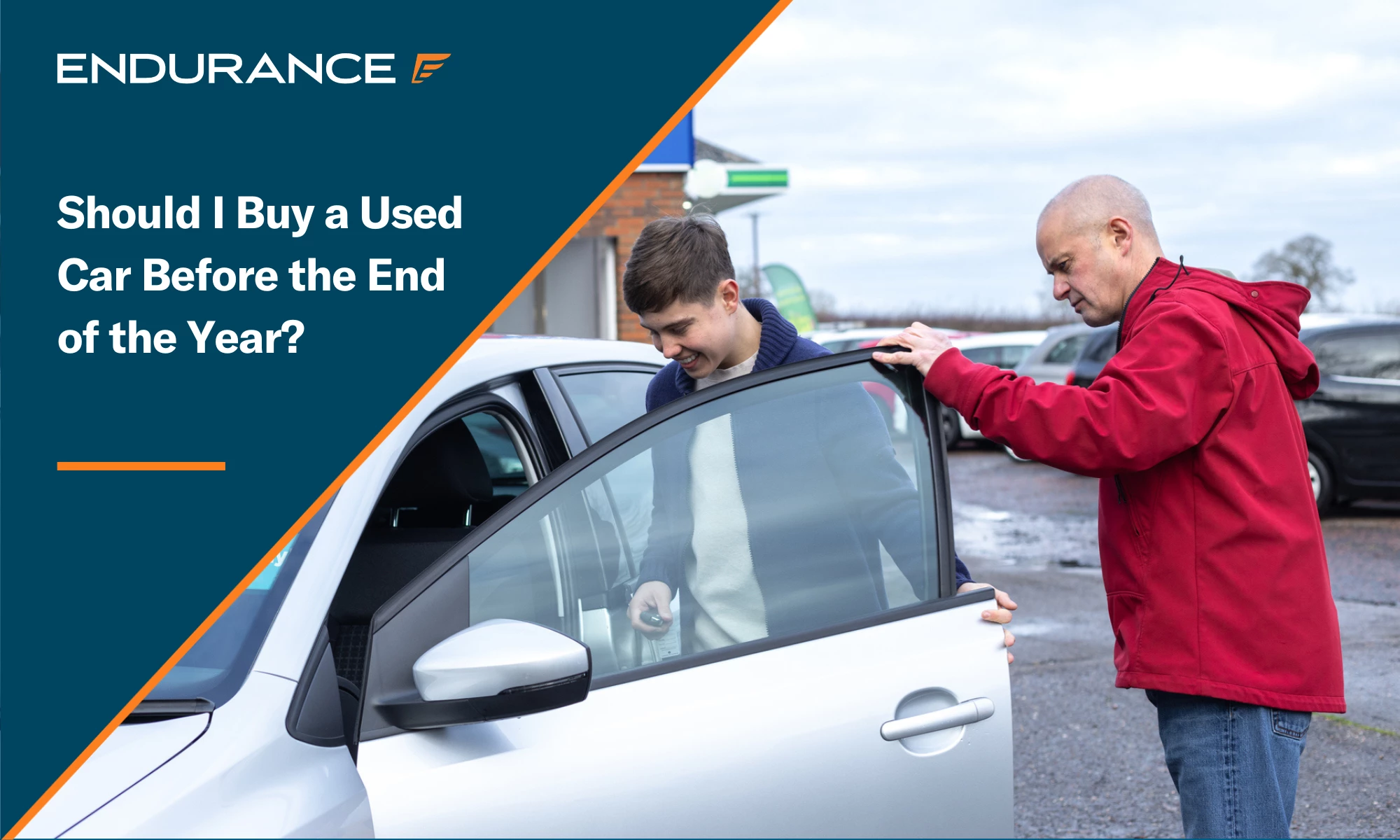 A man and his young son buying a used car