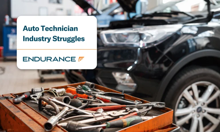 A vehicle repair shop with tools on a cart