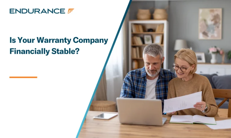 Couple Reviewing Documents Together at Home Office