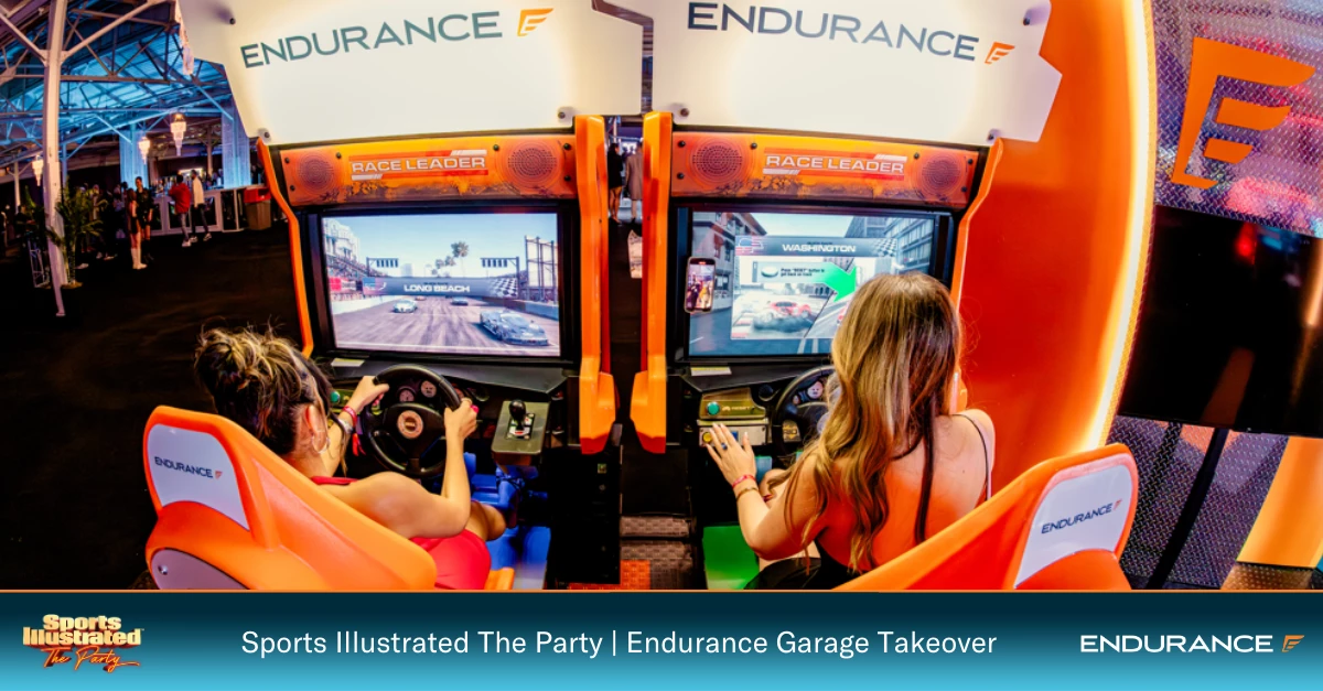 Two party guests enjoying the Endurance Racing Simulator 