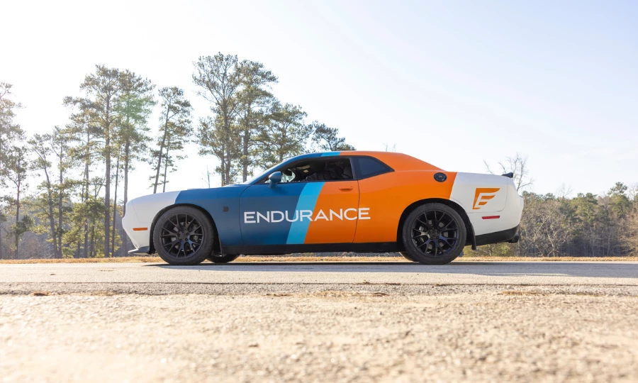 An Endurance branded car driving on a road