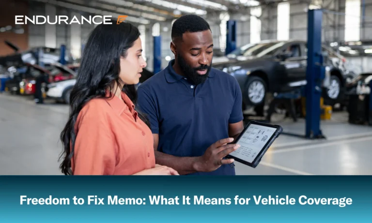 Mechanic showing a woman the diagnosis of her car, what the Freedom to Fix memo means for vehicle owners